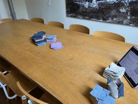 Workshop table set up with modular felt tiles ready for a session
