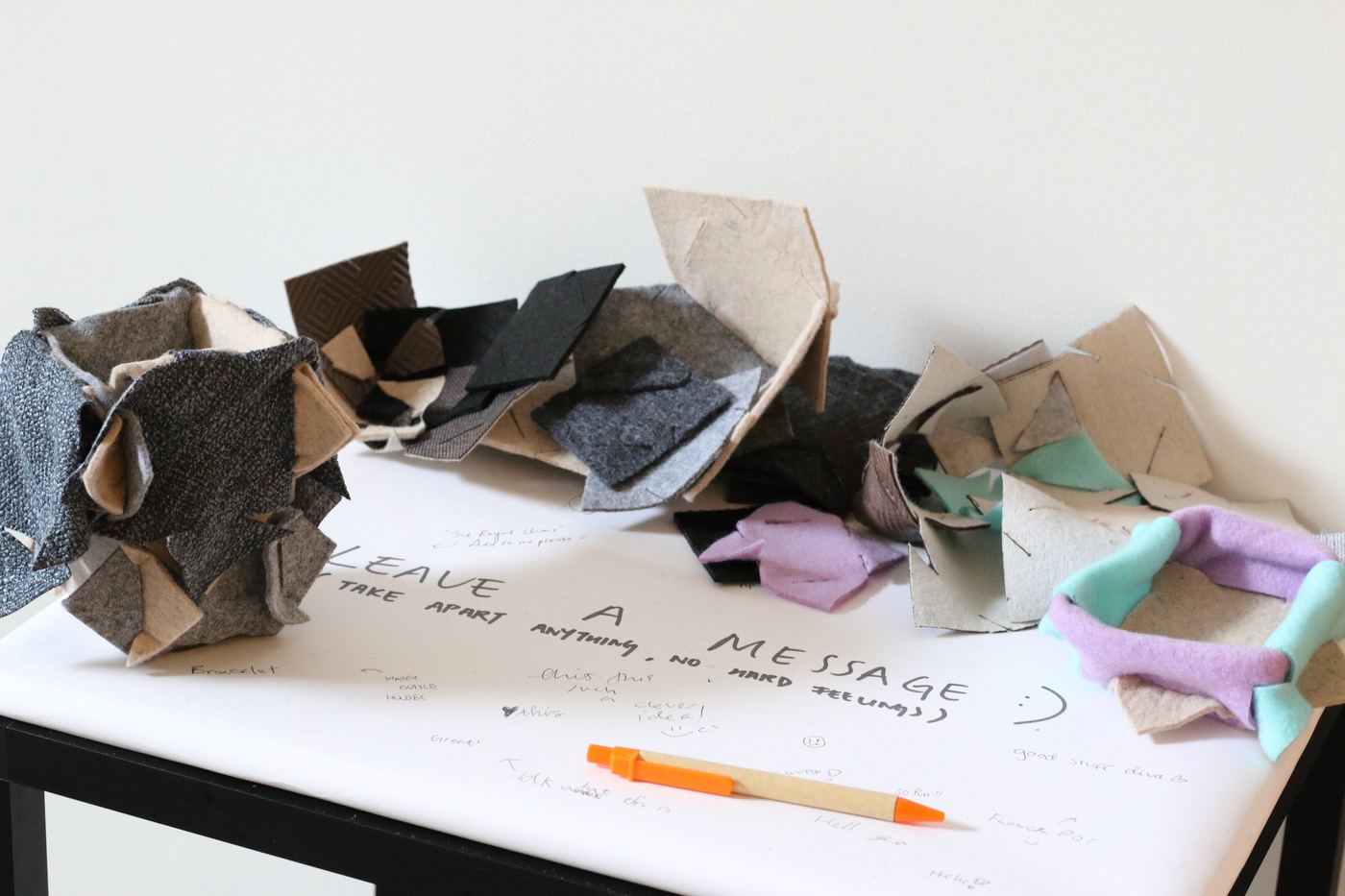 Tile pieces and visitor messages from the Zero Waste Festival activity table